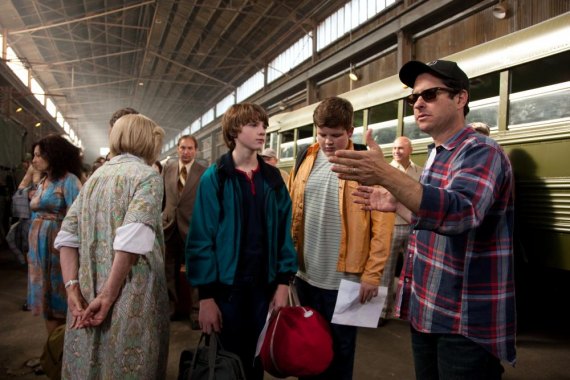 Photo credit: François Duhamel Center left to right: Joel Courtney (as Joe Lamb) and Riley Griffiths (as Charles) discuss a scene with director/writer/producer J.J. Abrams on the set of SUPER 8, from Paramount Pictures. © 2011 Paramount Pictures. All Righ